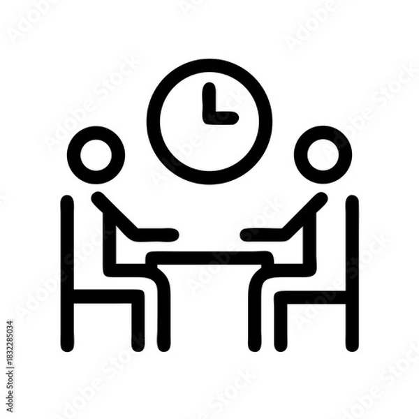Fototapeta Two people sitting at a table with a clock above them indicating a meeting or scheduled appointment time