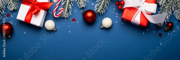 Obraz Christmas present, balls and fir tree branches.