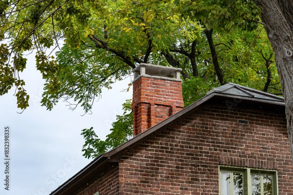 Obraz A damaged red brick chimney