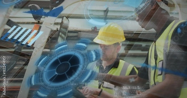 Obraz Reviewing handheld tablet two workers in high-vis vests and yellow hardhat at factory, AR graphics
