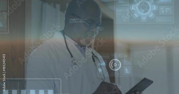 Fototapeta Holding tablet, physician wearing lab coat, stethoscope and glasses examining AR data in corridor