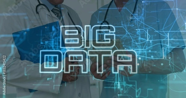 Fototapeta Standing two MDs consulting BIG DATA overlay in clinic, lab coat and scrubs, tablet, stethoscopes