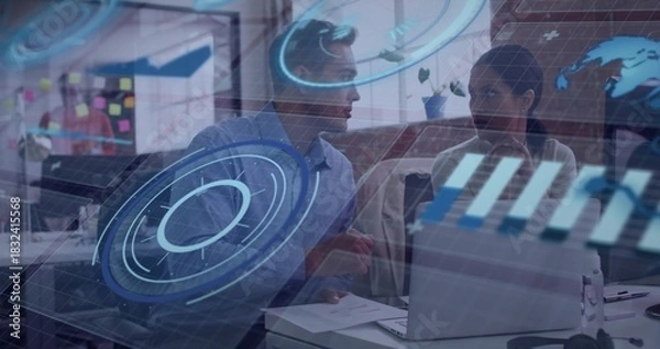 Fototapeta Collaborating two colleagues leaning over laptop in open-plan office, wearing business attire, HUD