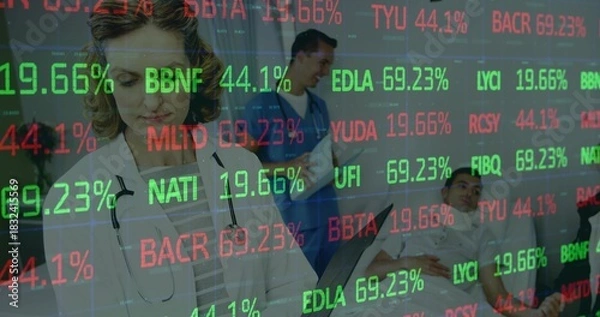 Fototapeta Reviewing tablet, doctor in white coat, stethoscope seeing patients in ward with red green tickers