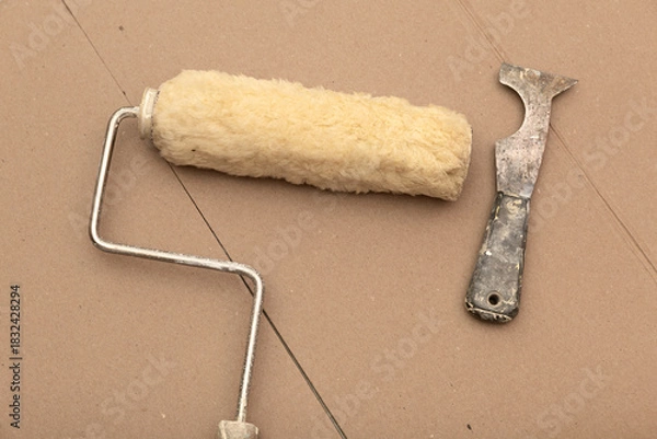 Fototapeta Paint roller and scraper multi-tool