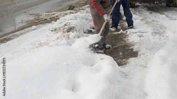 Obraz Clearing Snow From Sidewalk During Cold Winter Weather