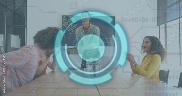 Fototapeta Laughing coworkers in plaid, polka-dot and mustard tops meeting around table in office, with HUD