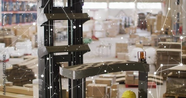 Obraz Showing forklift mast, carriage moving in warehouse, amber beacon, yellow hardhat, IoT overlay