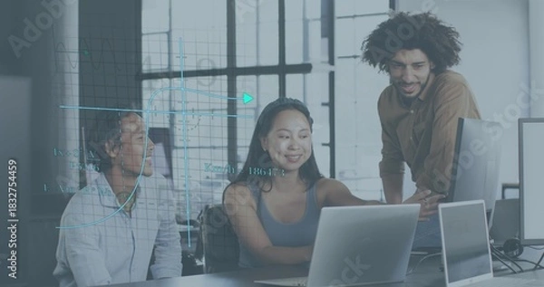 Fototapeta Working team in business wear leaning over laptops pointing at screen in modern office data overlay