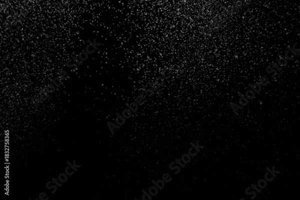 Obraz The falling white snow on a black background