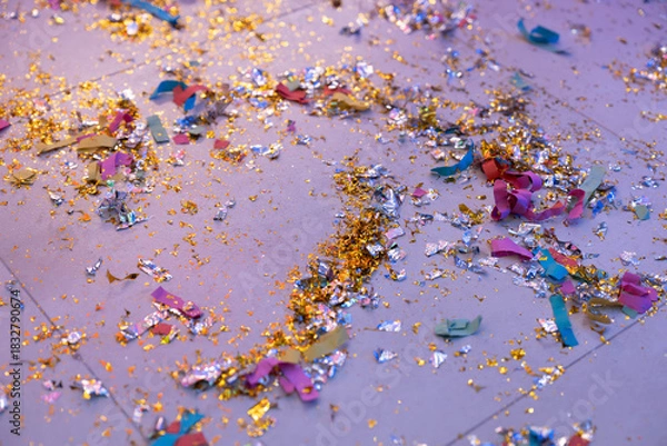 Fototapeta After the Party - Confetti left on the Floor - After-Party and Hangover Picture with many Colours. High quality photo
