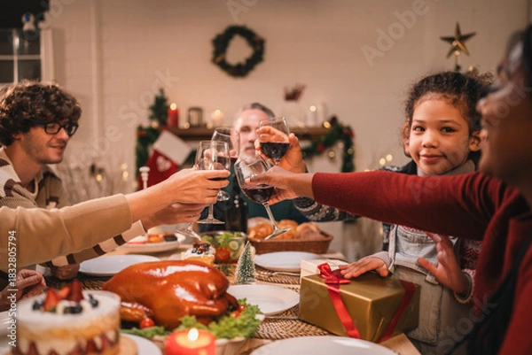 Fototapeta Joyful holiday gathering with friends sharing festive cookies, enjoying roast turkey, and sipping red wine in a warm atmosphere filled with laughter, desserts, and seasonal decorations