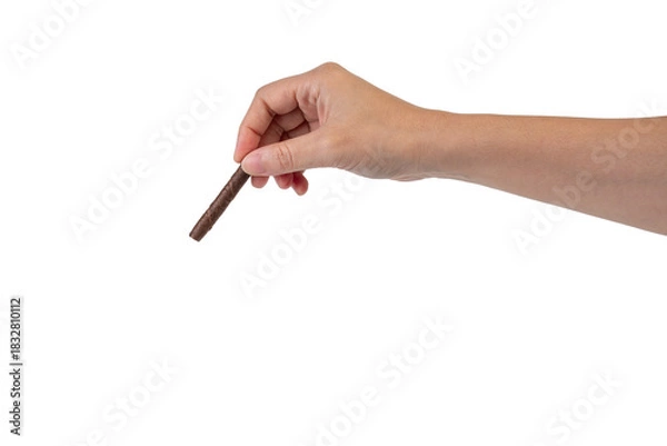Fototapeta Chocolate bar in hand on transparent background