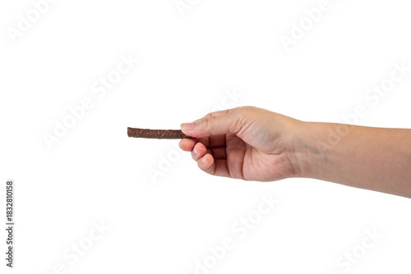 Fototapeta Chocolate bar in hand on transparent background