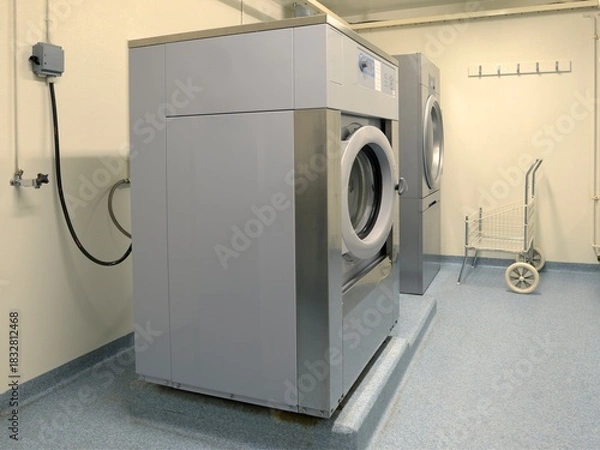 Obraz Shared apartment building laundry room with washing machine