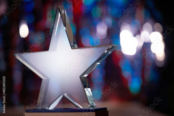 Obraz crystal star shape trophy against bokeh light as background