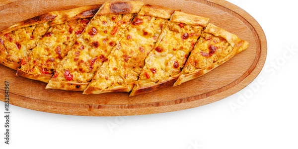 Fototapeta Delicious flatbread topped with cheese and tomatoes served on a wooden board