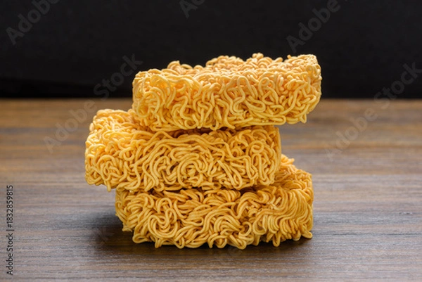 Fototapeta Closeup view of dried instant noodles on wooden table