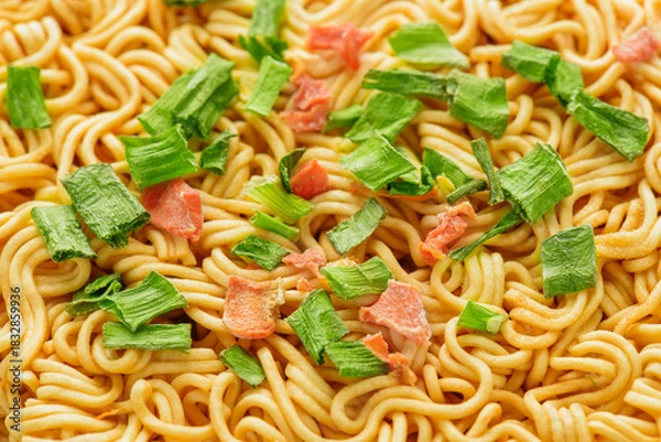 Fototapeta Closeup view of dehydrated vegetables on dried instant noodles