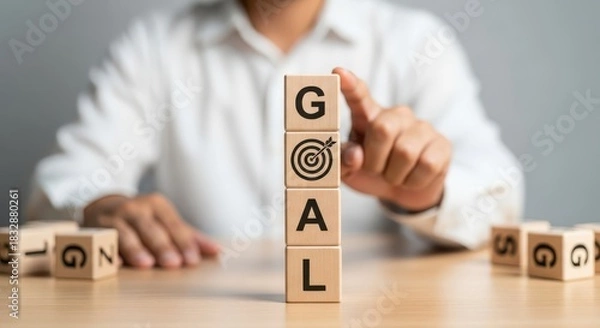 Obraz Setting Business Goals and Achieving Success Concept with Hand Stacking Wooden Blocks Labeled 'GOAL' and Target Icon