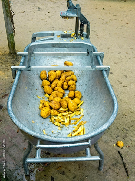Obraz metal container in which potatoes are placed to be cut and fried as chips