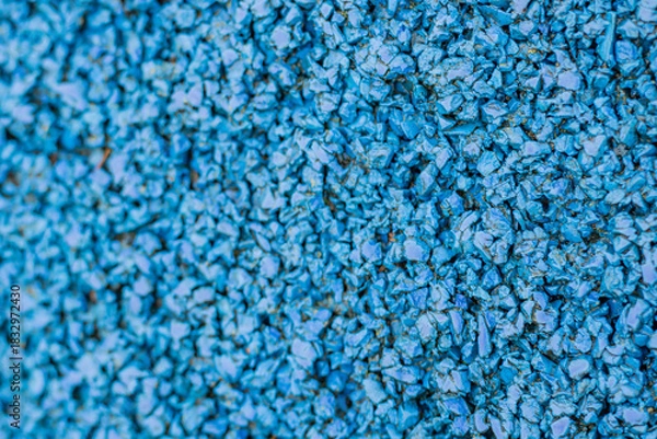 Fototapeta Texture of rubber flooring on a playground in close-up