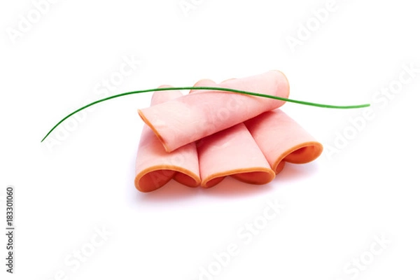 Obraz Cooked boiled ham sausage or rolled bologna slices isolated on white background with herbs and spices
