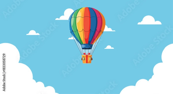 Fototapeta Colorful hot air balloon carrying a small gift box floating across a blue sky with fluffy white clouds and open space.