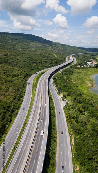 Fototapeta Drone shot The M6 motorway Nakhon Ratchasima Province - Bang Pa-in Lam Ta Khong River and Mountain. Motorway Korat Thailand