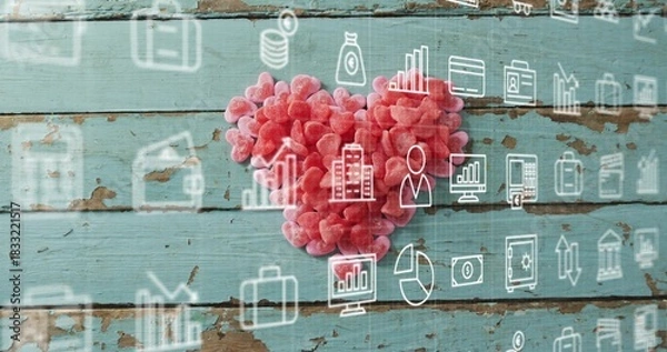 Fototapeta Showing heart-shaped candy cluster sitting on worn turquoise planks, with business icons overlay