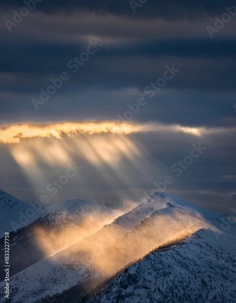 Obraz Majestic Mountain Landscape with Sunlight Breaking Through Clouds