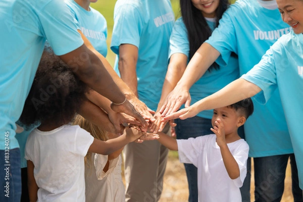 Fototapeta volunteer Community unity through diverse hands coming together. volunteer charity people. charity community service event, ngo business and outreach, Group Diverse people meeting at park for donation