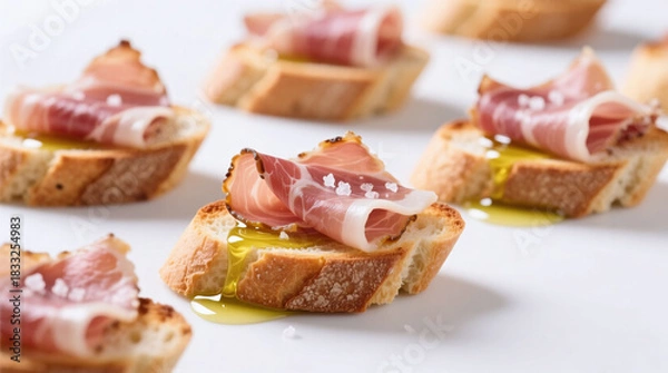 Fototapeta crostini with prosciutto isolated on white background