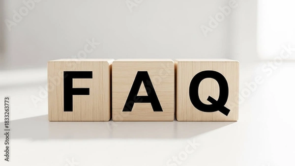 Fototapeta Three wooden blocks displaying the letters f a q in black against a white background surface area