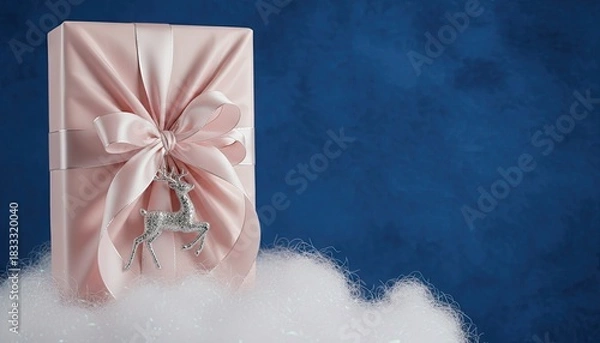 Fototapeta Elegant holiday gift-wrapped present isolated on solid background