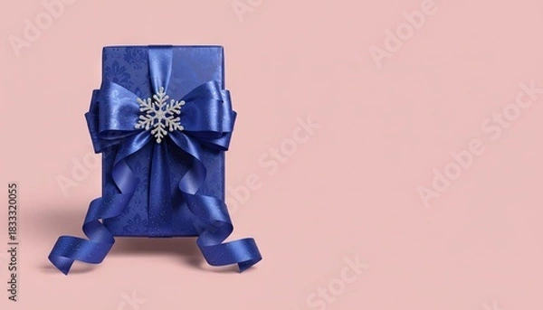 Fototapeta Elegant holiday gift-wrapped present isolated on solid background