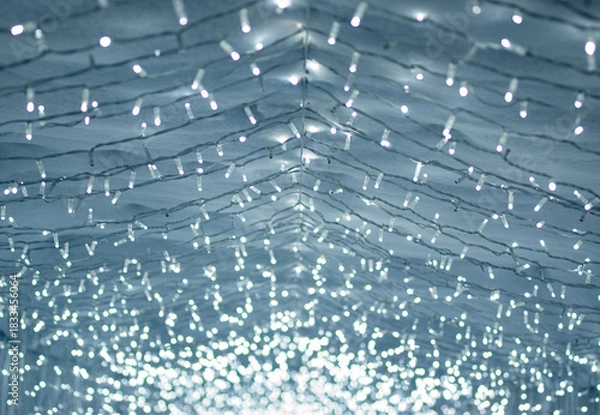 Obraz  Background of Glowing Christmas lights Fading into the Distanceю