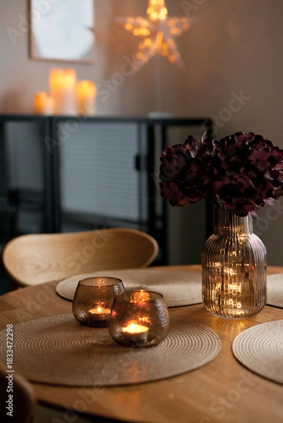 Obraz Led lights and interior decor on wooden table in scandinavian room. Hygge life style.
