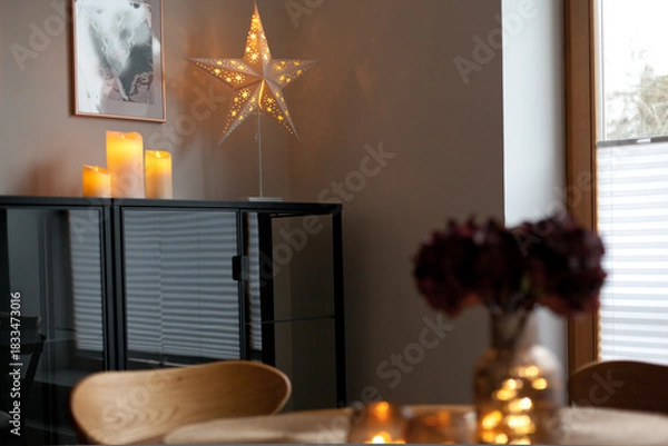 Obraz Led lights and interior decor on wooden table in scandinavian room. Hygge life style.
