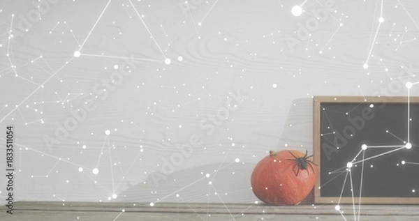 Obraz Showing orange pumpkin and chalkboard on wood table by wood wall, constellation overlay, copy space