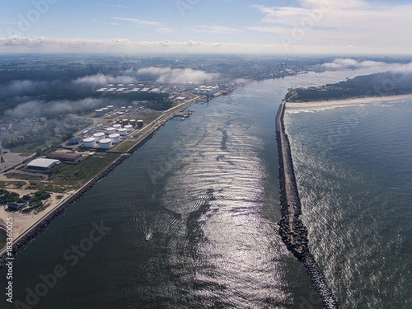 Fototapeta Aerial view over Klaipeda pier entrance to the Baltic sea in Lithuania, during summer time.	