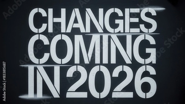 Fototapeta Stenciled announcement proclaiming alterations arriving in the year twenty twenty six displayed on a dark surface