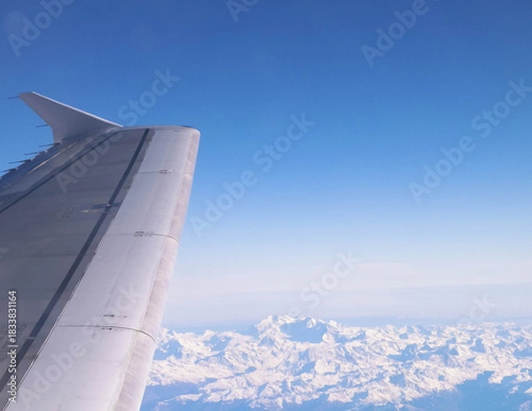 Fototapeta Airplane wing seen from the window.