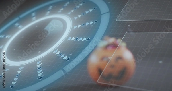 Fototapeta Showing circular HUD glowing with rings and spinning arrows in virtual grid with carved pumpkin