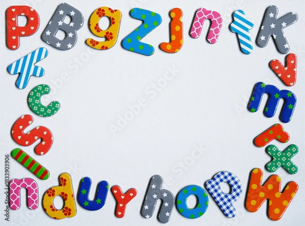 Fototapeta Colorful Magnetic Letters Border Frame on White Background