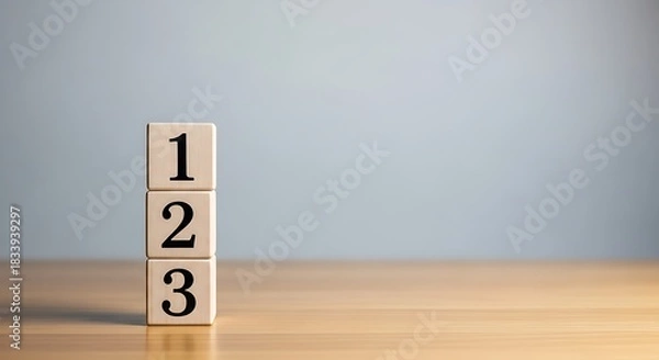 Obraz Three Numbered Wooden Blocks Stacked Vertically on a Desk, Illustrating a Step-by-Step Process or Sequential Order