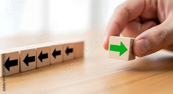 Obraz Choosing a new path A hand positions a green arrow, symbolizing innovation, unique vision, and strategic direction change