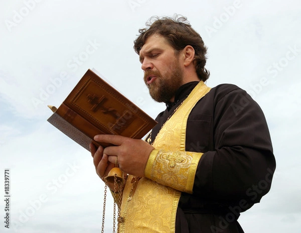 Obraz Orthodox priest reads prayer