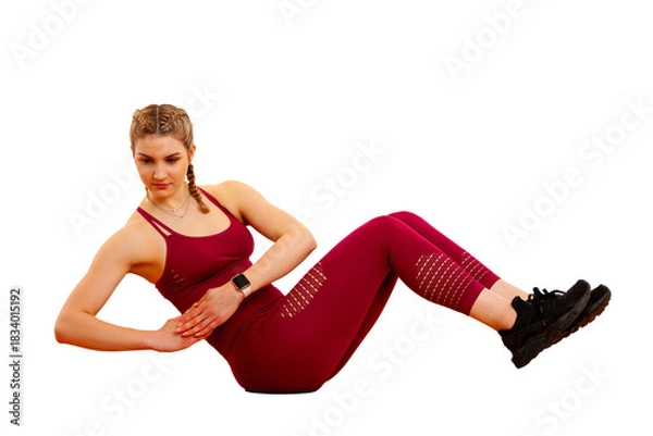 Obraz A woman demonstrates an effective book ab exercise, focusing on core strength and stability. This engaging workout showcases her dedication to fitness and healthy living, perfect for at-home training