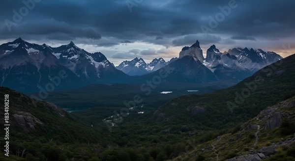 Fototapeta Majestic Mountain Range Under Dramatic Stormy Skies.